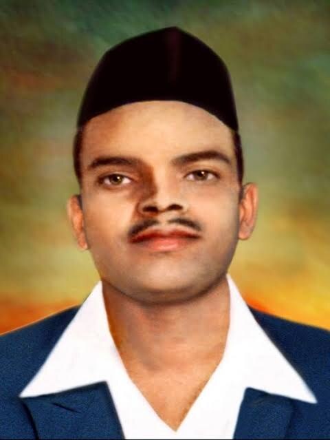 Colourised portrait of Shivaram Rajguru wearing a black cap, dark jacket and white shirt collar